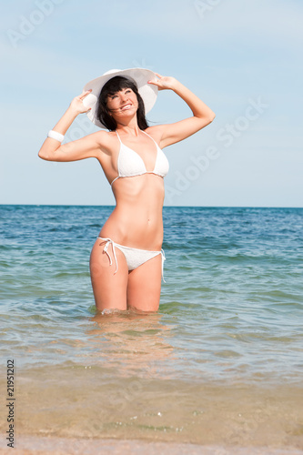 Young fashion woman on the beach © Dmytro Sunagatov