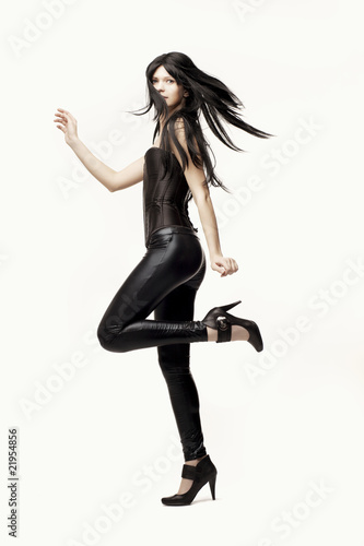 Àmazing girl in black leather pants and corset