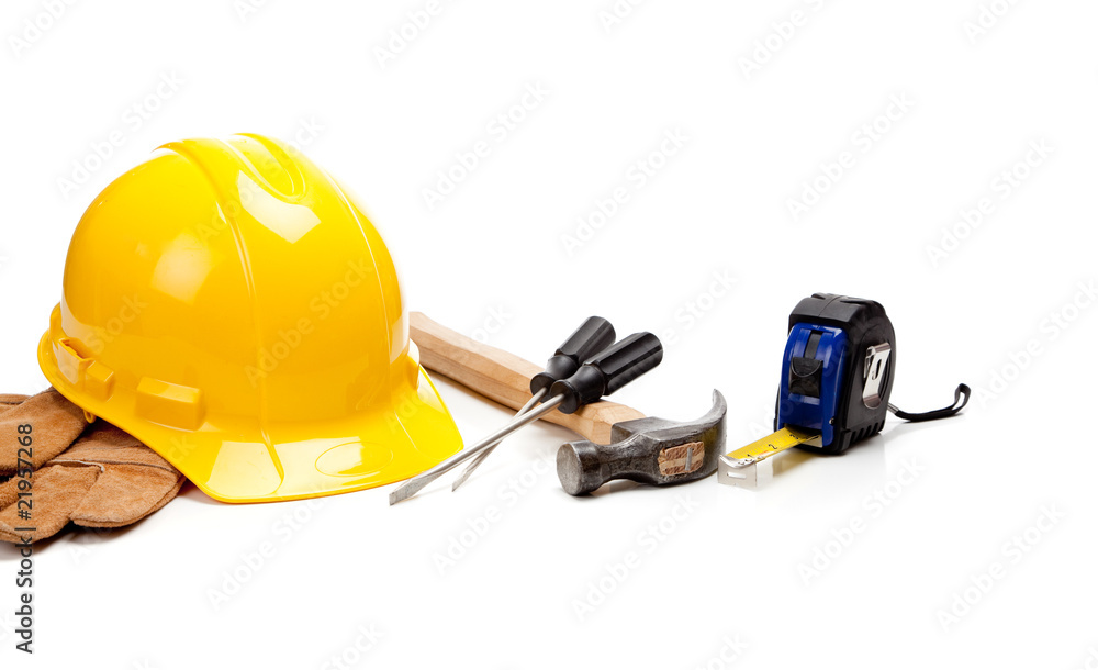 Hard hat, gloves and tools on a white background Hard hat, gloves and tools on a white background