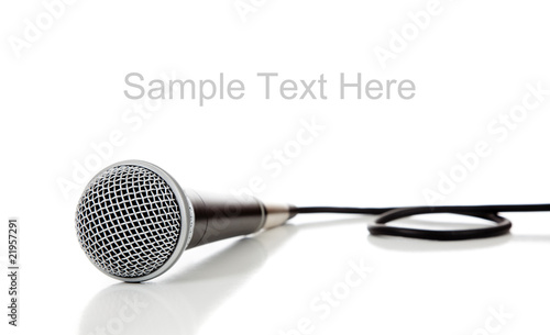 Black and silver microphone on white with copy space