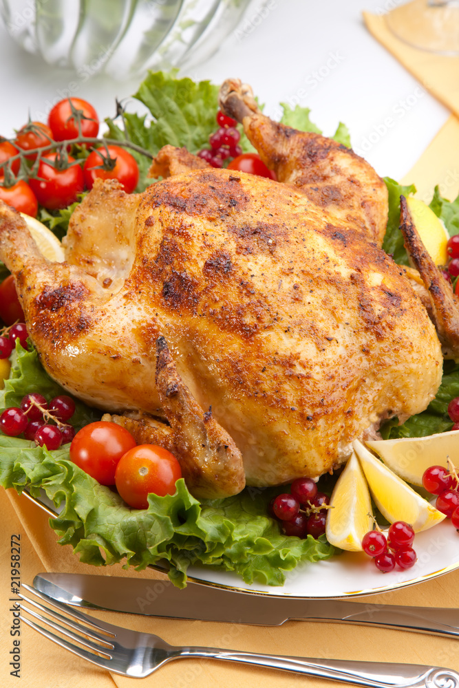 Whole roasted chicken on table Whole roasted chicken on table
