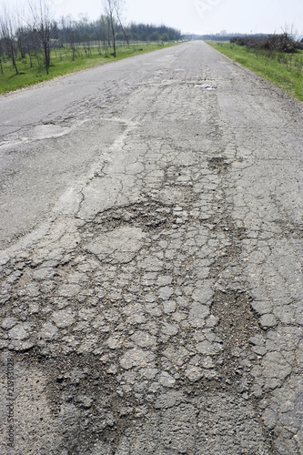 a large pothole on a country road