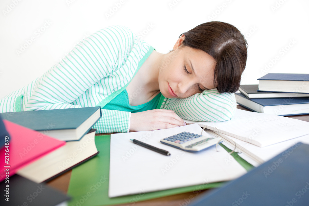 Exhausted student sleeping while studying Exhausted student sleeping while studying
