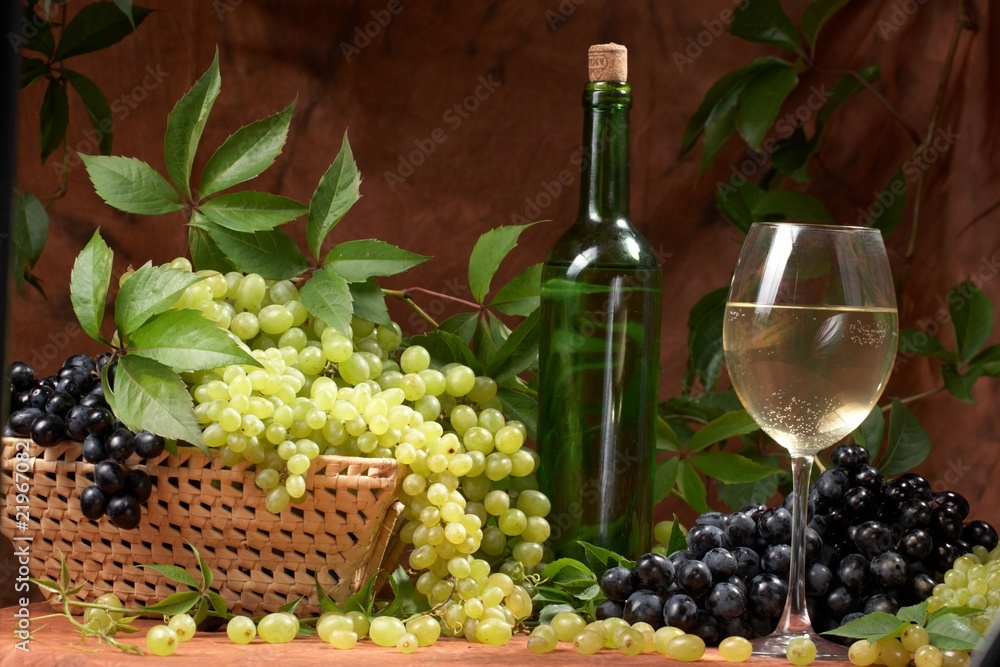 White dry wine, fresh clusters of a grapes