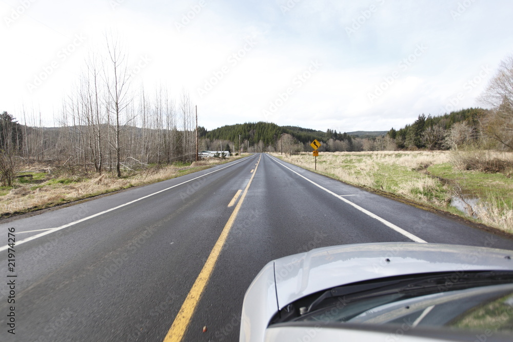 Fototapeta premium Traveling on a rural highway by car.