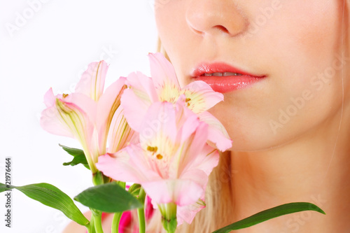 Portrait of a woman holding pink flowers