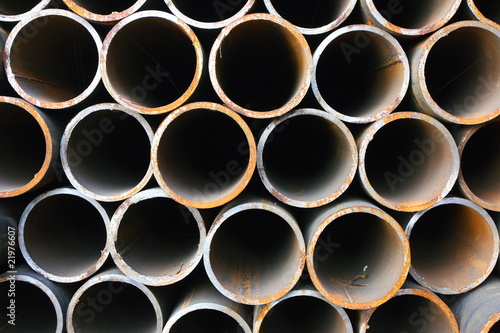 Close-up of steel high-pressure pipes bunch in warehouse