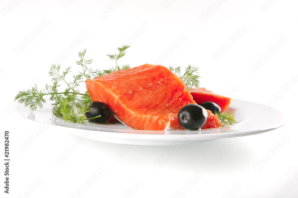 pink salmon on white plate with olives pink salmon on white plate with olives