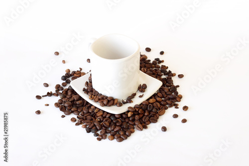 coffee mug spoon with spilled coffee on white