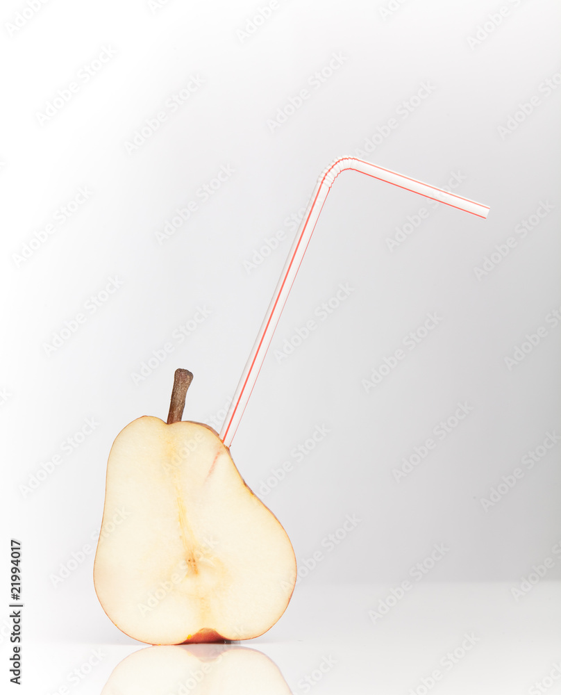 sliced pear with drinking straw sliced pear with drinking straw