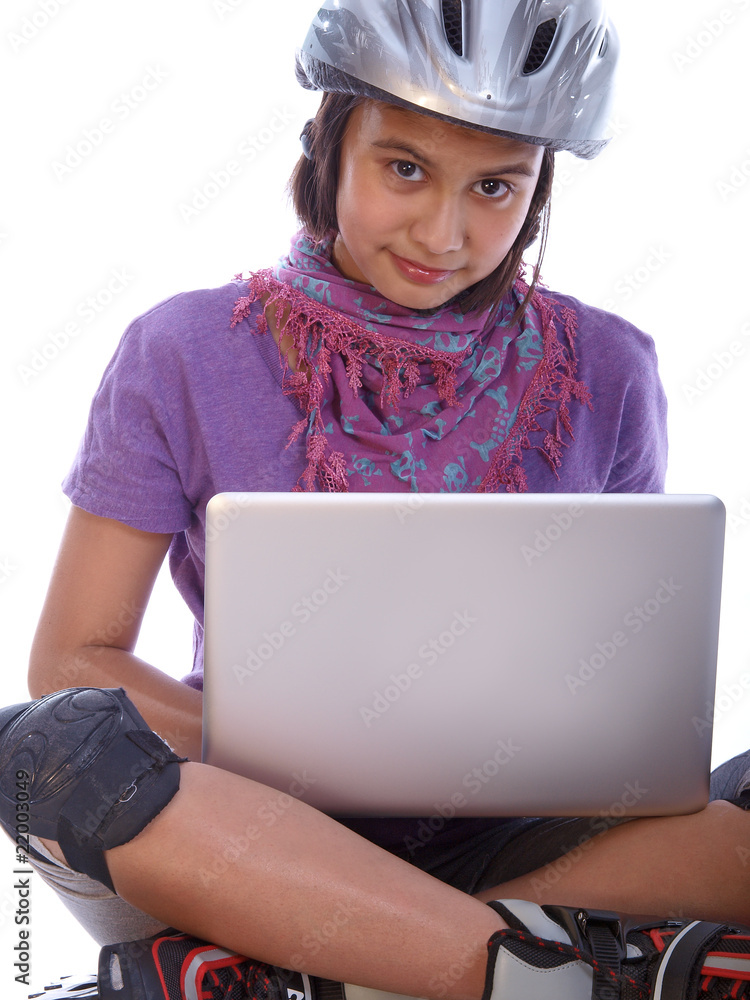 young girl relaxing with the laptop after rollerblading young girl relaxing with the laptop after rollerblading