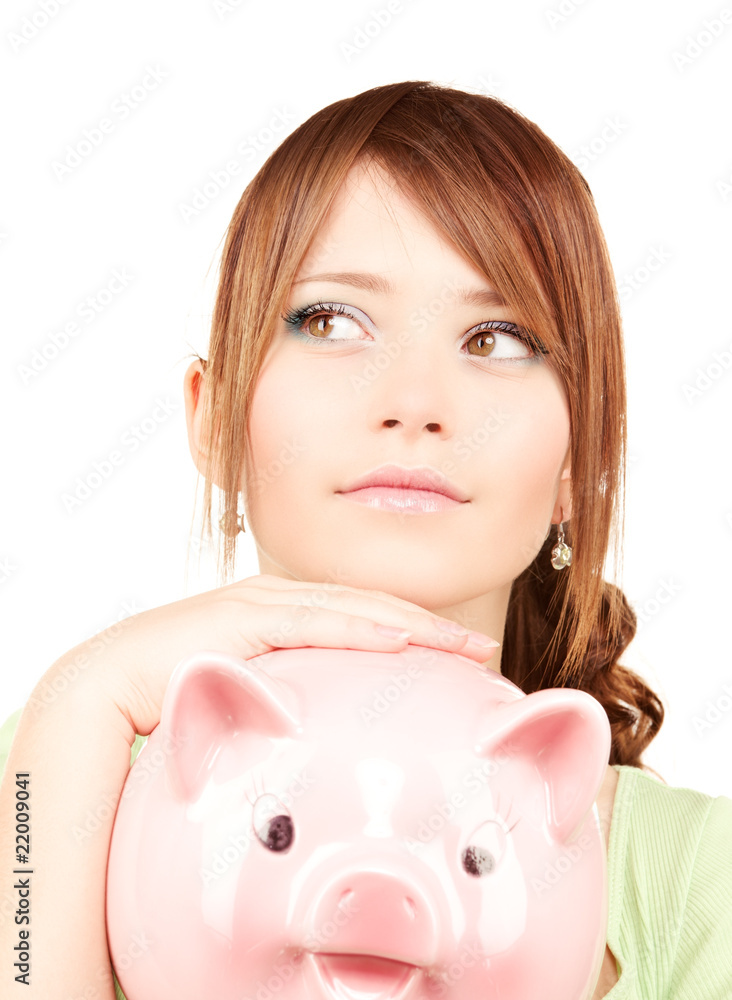 lovely teenage girl with piggy bank lovely teenage girl with piggy bank