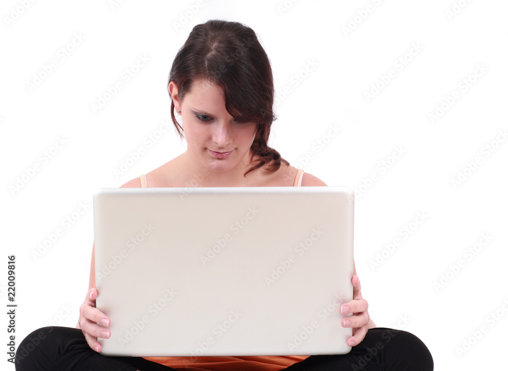 Portrait of teenage girl sitting and holding laptop Portrait of teenage girl sitting and holding laptop