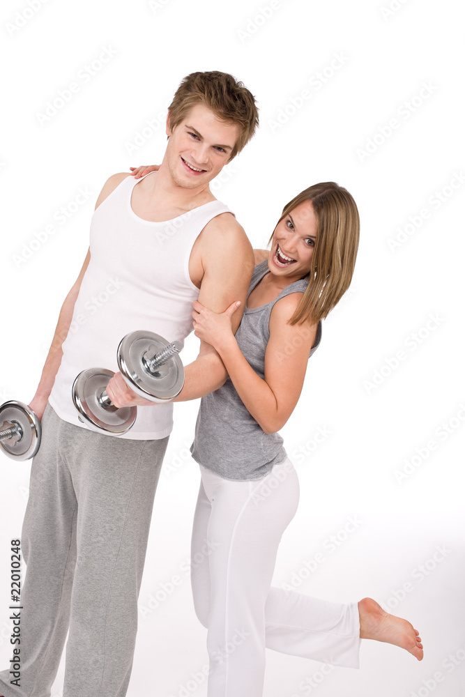 Fitness - Smiling healthy couple exercising with weights Fitness - Smiling healthy couple exercising with weights