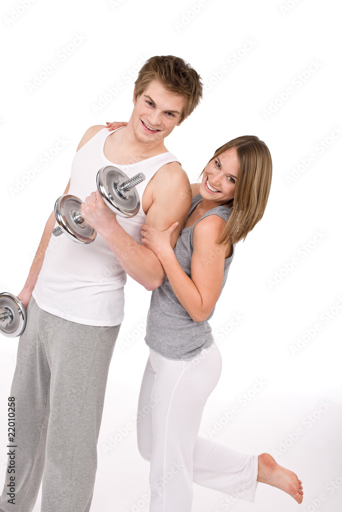 Fitness - Smiling healthy couple exercising with weights Fitness - Smiling healthy couple exercising with weights