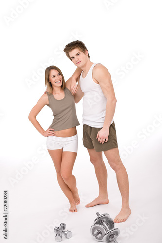 Fitness - Young healthy couple with weights