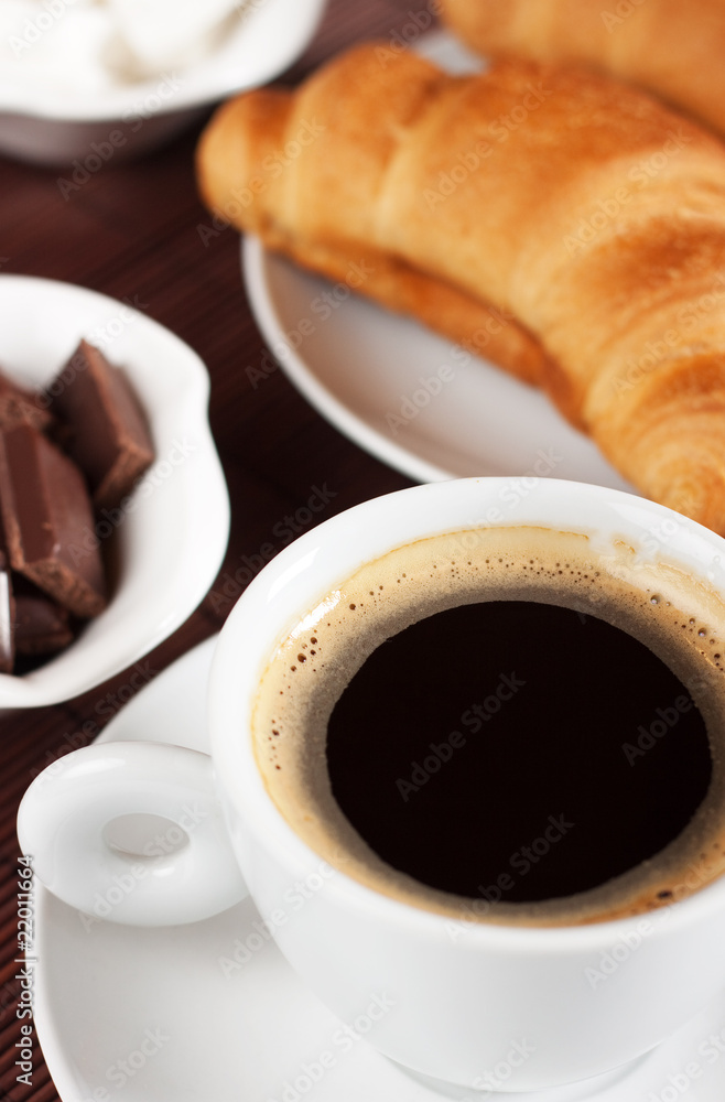 Black coffee and croissants Black coffee and croissants