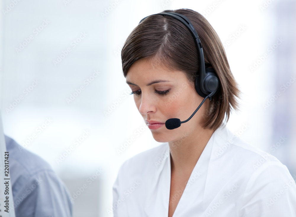 Portrait of a brunette customer agent at work Portrait of a brunette customer agent at work
