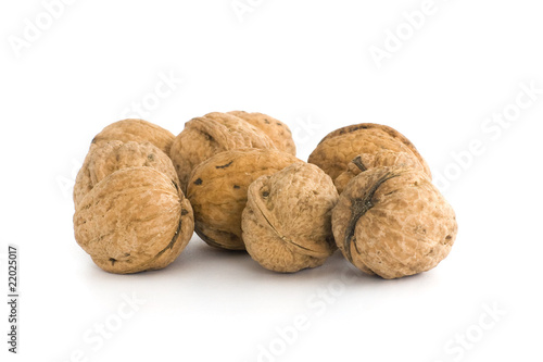 Small group of walnuts. Isolated on white background.
