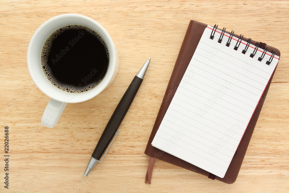 Black coffee,notebooks and pen on wood background Black coffee,notebooks and pen on wood background