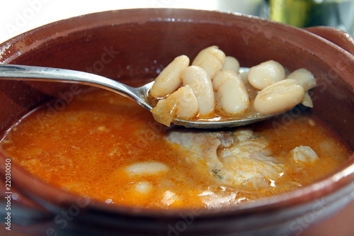 Steaming stew of beans and quail  typical dish from Spain photo