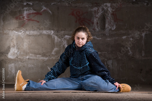 Hip hop dancer in modern style over brick wall