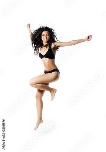 Cute women in swimsuit jumping