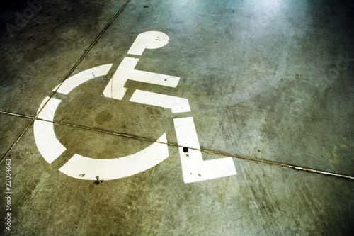 Disability sign on grunge background garage floor