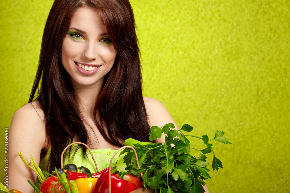 Portrait of a girl holding in hands full of fruits Portrait of a girl holding in hands full of fruits