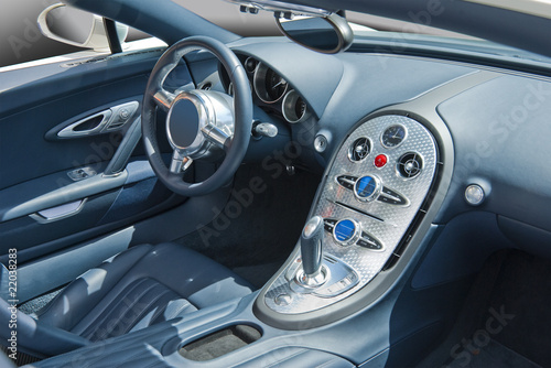 Sports car interior in blues and turned aluminum console