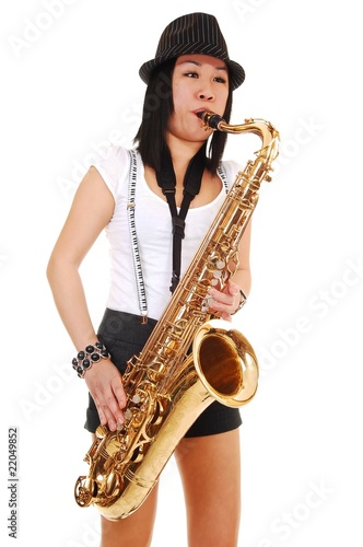 Canvas Print Chinese girl playing the saxophone.