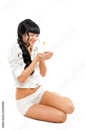 beautiful woman holding green plant