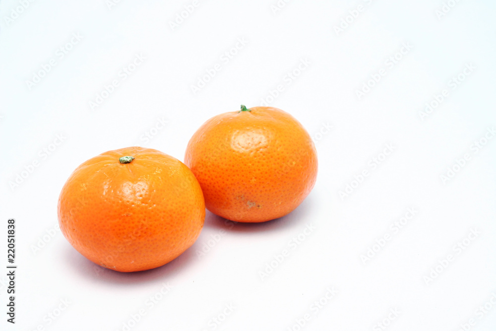 Two small Mandarin oranges. Two small Mandarin oranges.