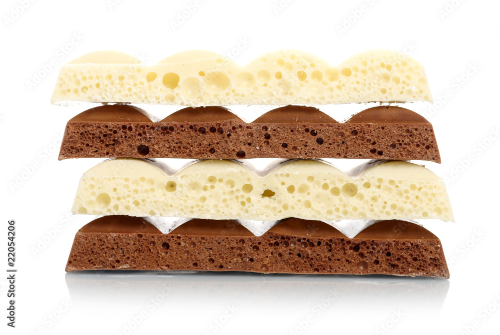 Stack of brown and white porous chocolate Stack of brown and white porous chocolate