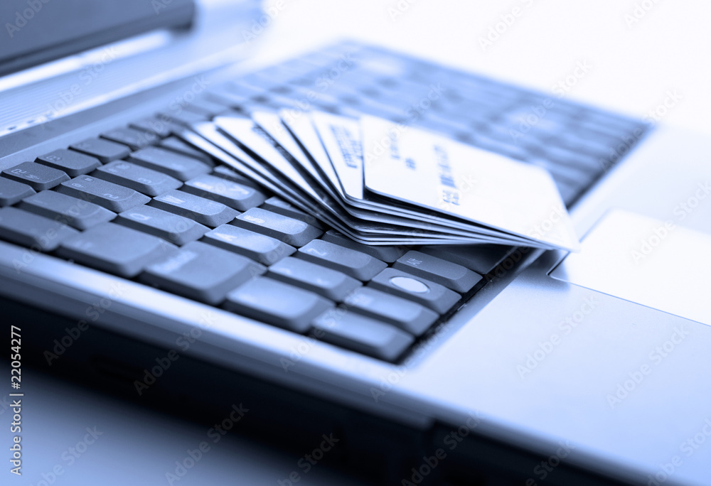 Credit cards and laptop. Shallow DOF.