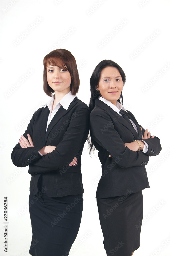 Two young business women isolated on a white backgorund Two young business women isolated on a white backgorund