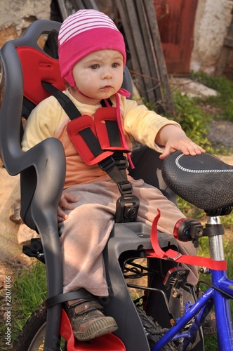 baby in bicycle chair