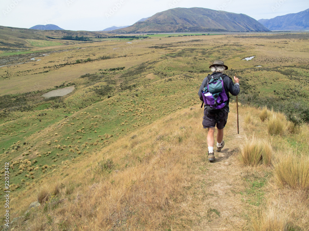 Hiker walking the hills of New Zealand