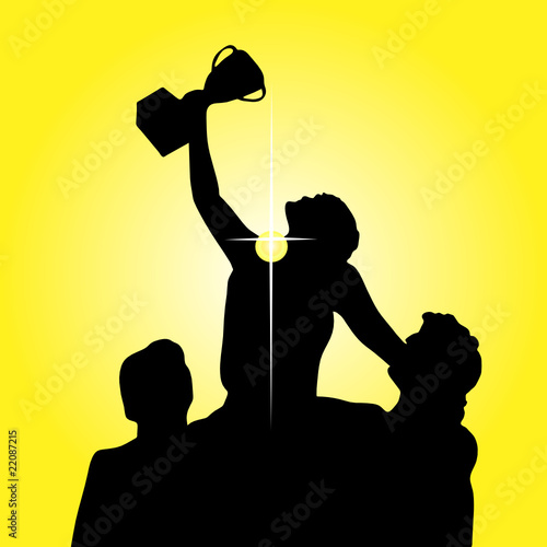 winner holding cup