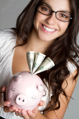 Businesswoman Holding Piggy Bank photo