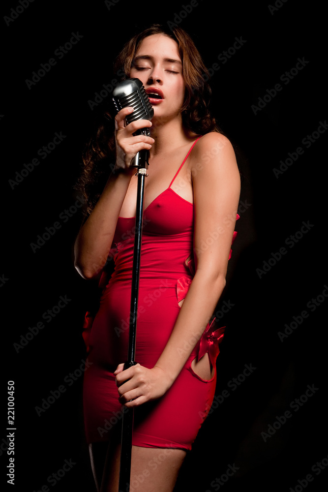 Beautiful singer singing with microphone Beautiful singer singing with microphone