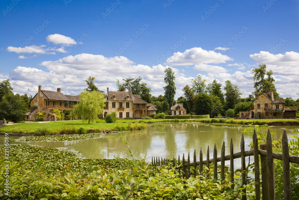 The Hamlet houses behind a lake of Versailles Chateau The Hamlet houses behind a lake of Versailles Chateau