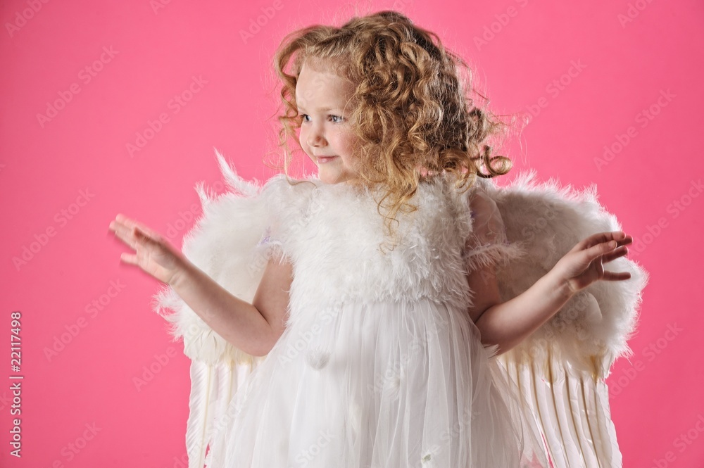 Beautiful little angel girl isolated on pink background Beautiful little angel girl isolated on pink background