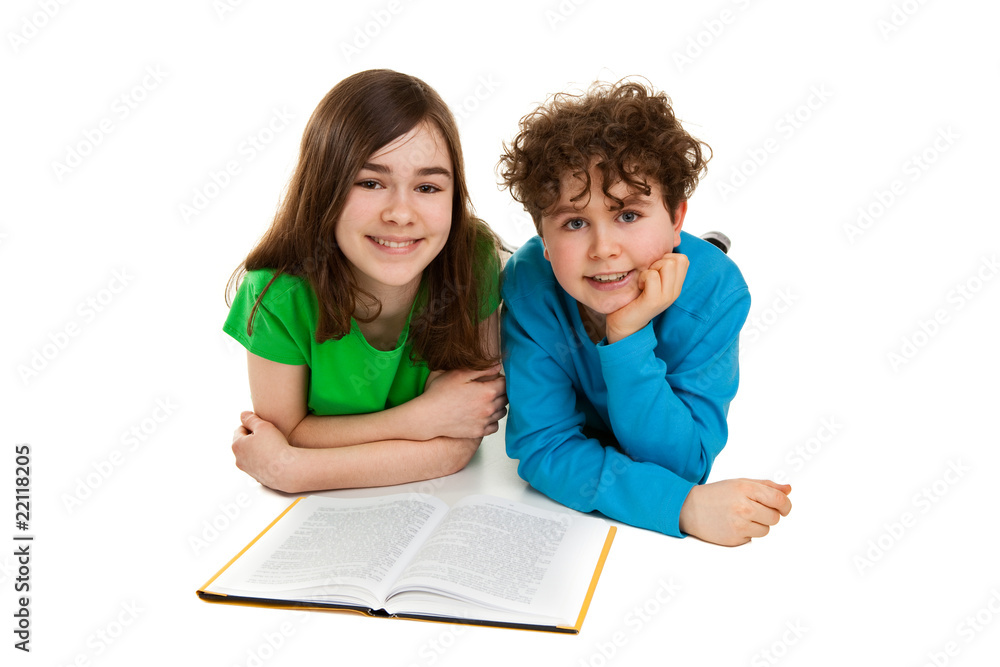 Girl and boy reading book, lying Girl and boy reading book, lying
