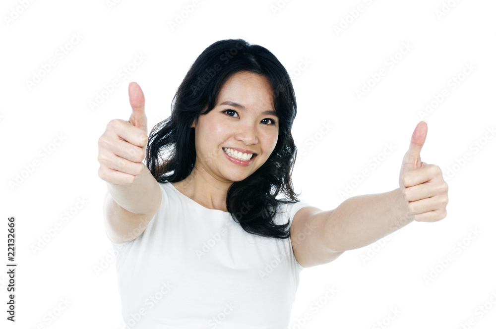 Attractive young woman giving thumbs up