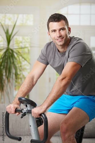 Man training on exercise bike