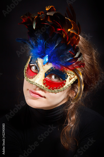 Young woman in carnival mask