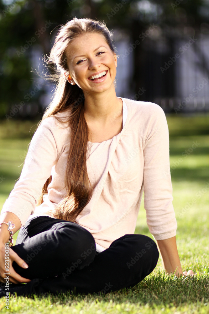 beautiful young woman relaxing in the grass beautiful young woman relaxing in the grass