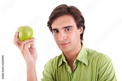 man eating a green apple