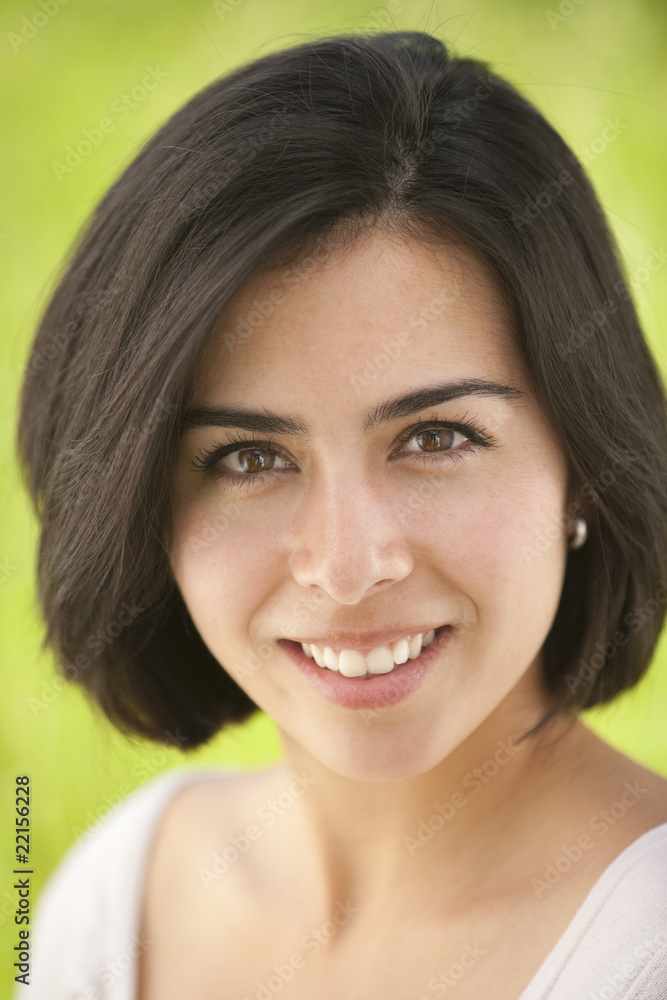 portrait of a beautiful, young Hispanic woman in a meadow portrait of a beautiful, young Hispanic woman in a meadow